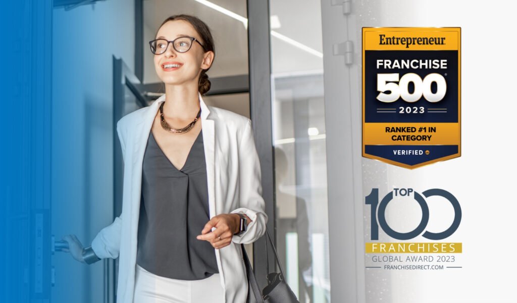 Woman coming out of a building with Entrepreneur Franchise 500 2023 Ranked #1 in category Award and Top 100 Franchises Global Award 2023 Franchisedirect.com Award